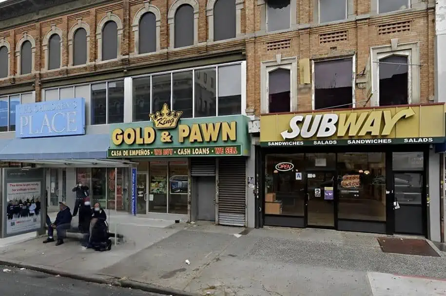 King Gold & Pawn shop at 1683 Pitkin Ave in Brooklyn, NY. Shop front with a green awning and business sign in gold letters.