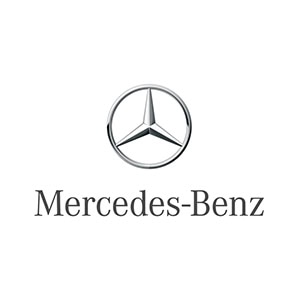 The Mercedes-Benz logo, a luxury German car brand. A silver three pronged star resting inside of a laurel wreath.